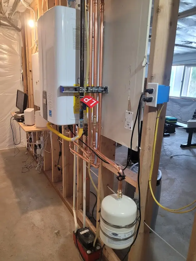 Licensed plumber repairing a kitchen sink in Aztec